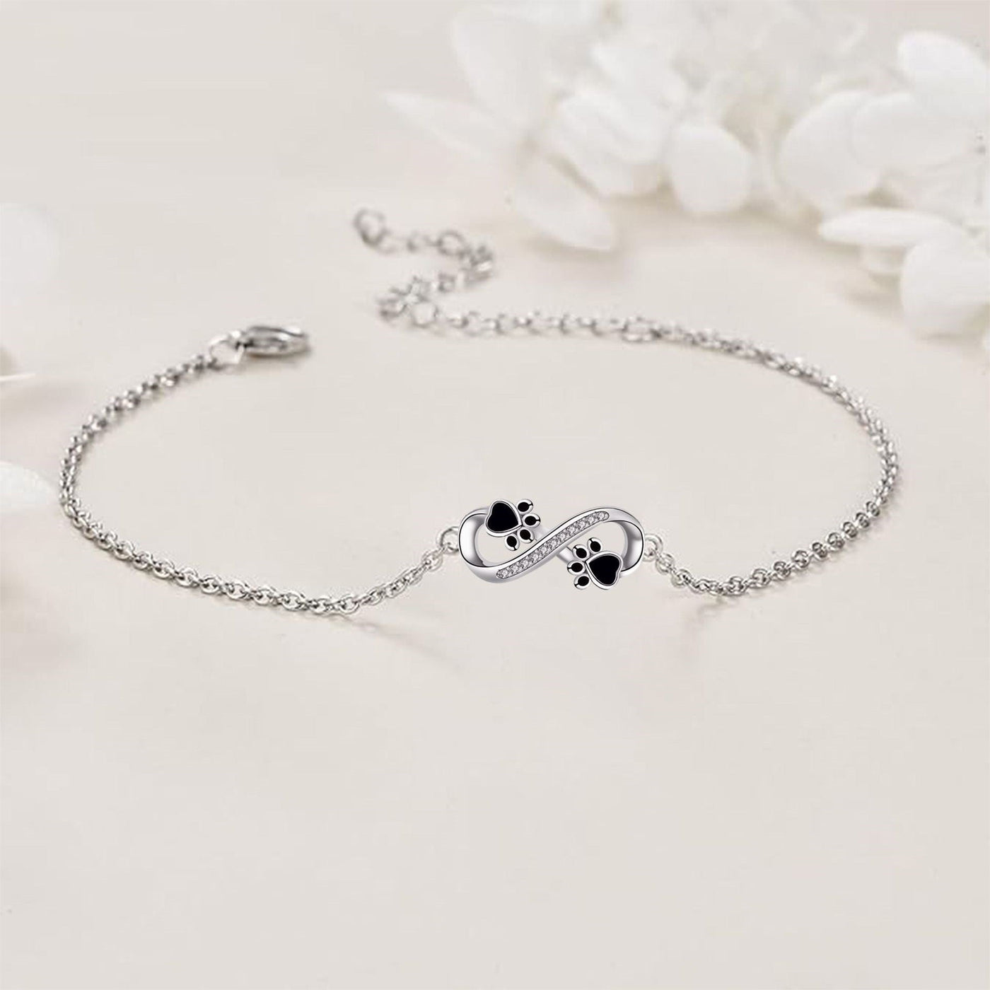 Unendlichkeits-Symbol Armband mit Pfötchen-Anhänger & Zirkonia