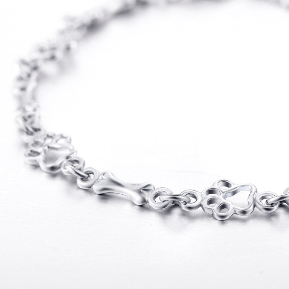 Armband mit Hundepfoten- und Knochenanhängern aus reinem Silber